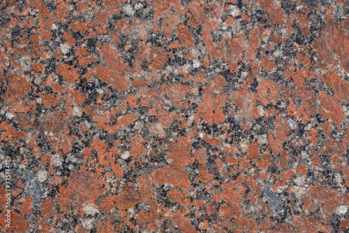 Granite surface in orange, gray, white, black mix. Copy space. Minimalism.  © Ganna Zelinska