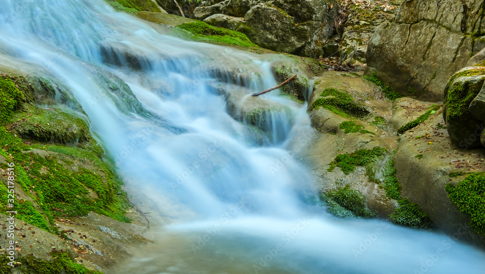 beautiful closeup waterfall on a mountain river beautiful closeup waterfall on a mountain river