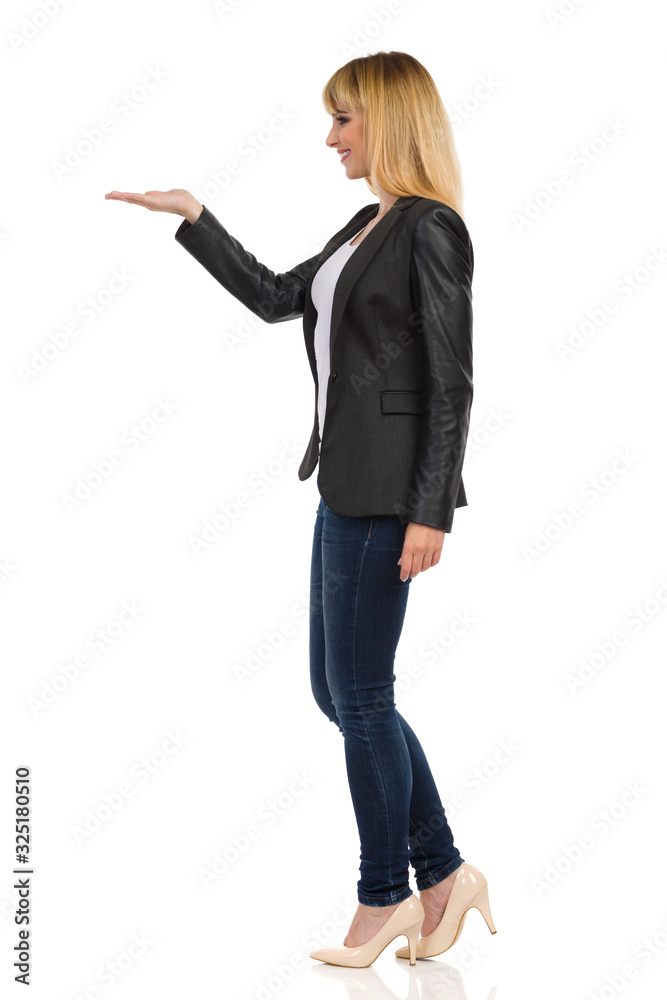 Young In Formal Wear Is Presenting. Side View. Young In Formal Wear Is Presenting. Side View.