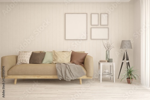 Modern living room in white color with sofa and empty frames on a wall. Scandinavian interior design. 3D illustration © AntonSh