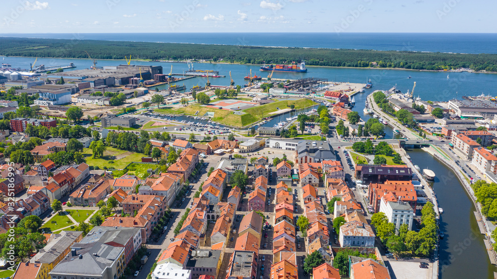 Beautiful panoramic Aerial view photo from flying drone on Klaipeda port and city background a sunny summer day. Klaipeda, Lithuania (series)