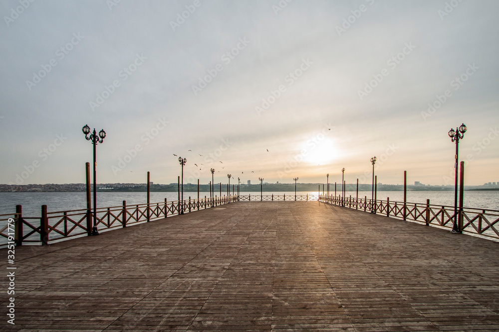 Romantic wooden walkway on the lake