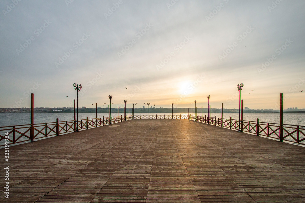 Romantic wooden walkway on the lake Romantic wooden walkway on the lake