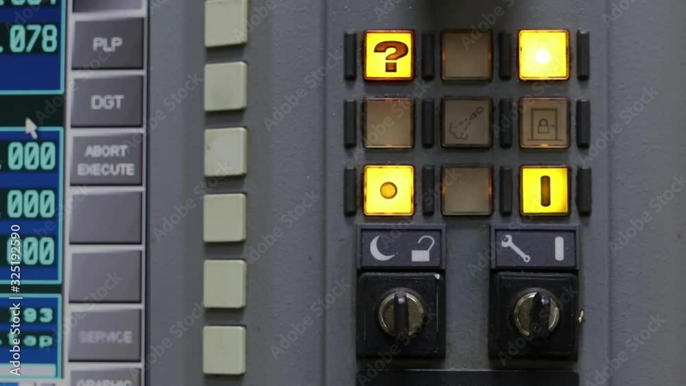 The dashboard of the CNC system. A button with a question mark flashes. The dashboard of the CNC system. A button with a question mark flashes.