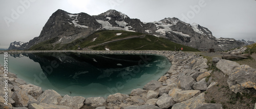 Three Sisters and artificial lake in the Swiss Alps; Eiger, Jungfrau und Mönch