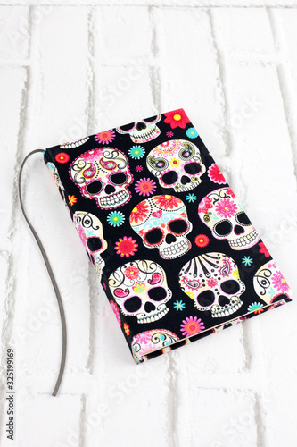 Handmade notebook with skulls fabric cover