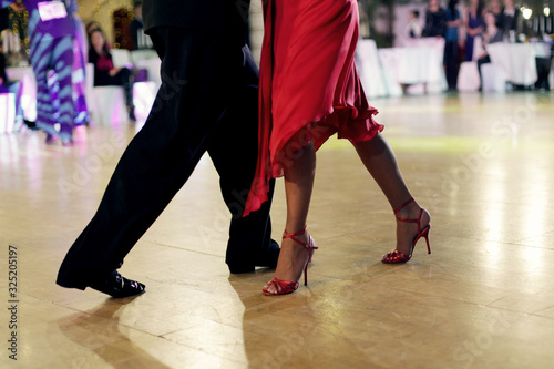 Beautiful woman in red dress dancing Argentinian tango  © 1L26