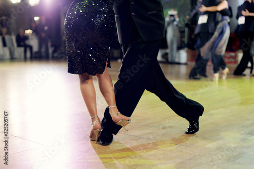 Graceful lines of legs of Argentina tango dancers