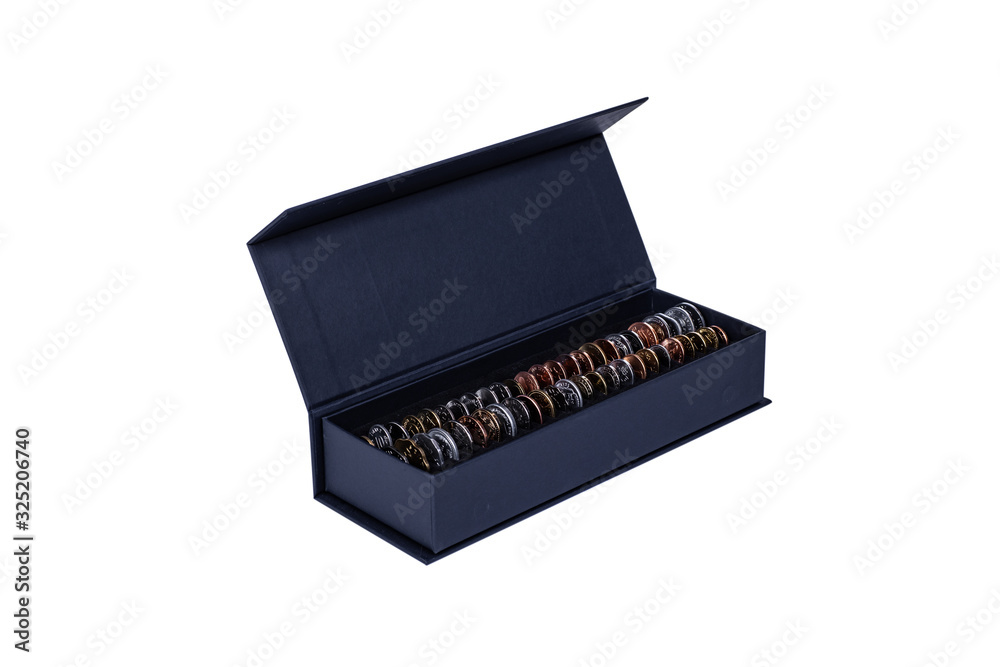 Lots of different coins in a gift box solated on white background. Lots of different coins in a gift box solated on white background.
