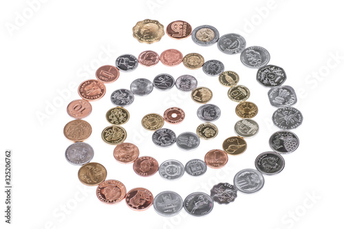 Lots of different coins isolated on white background.