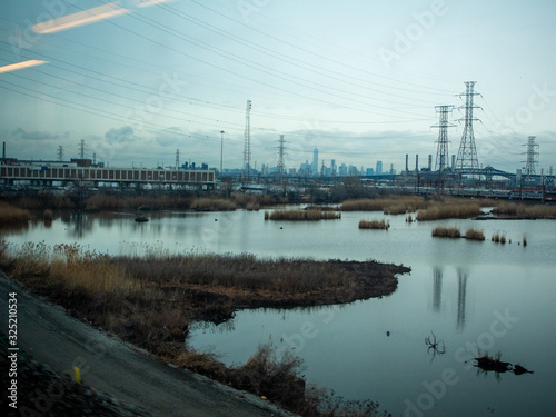 industrial landscape through the train window in New Jersey near New York City © Michele