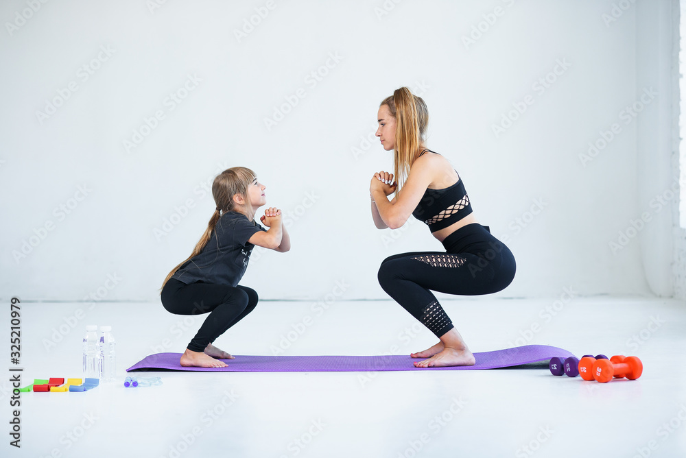 Fototapeta premium children practicing are engaged in gymnastics and yoga with teacher