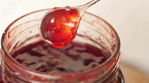 red strawberry jam, raspberry in a jar