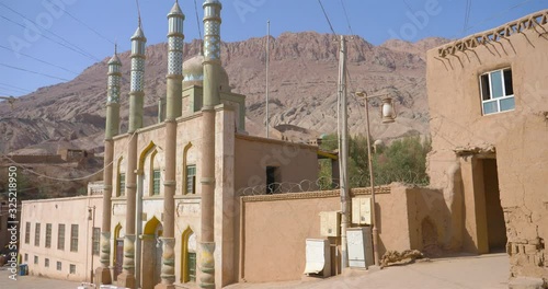 Ancient traditional residential old house in Tuyoq village valley inTurpan Xinjiang Province China. photo