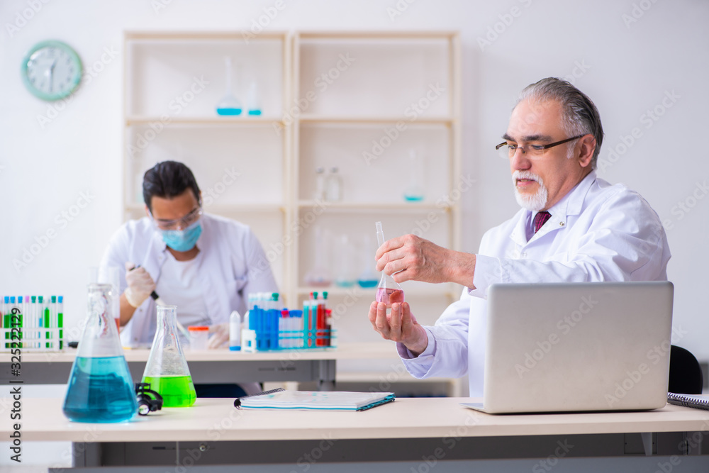 Two chemists working in the lab Two chemists working in the lab