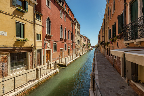 VENICE, ITALY - August 03, 2019: Narrow pedestrian streets of Venice bitween the channels. Some quiet places almost without people © Yury