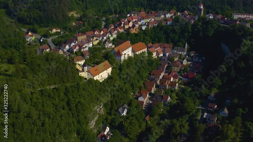 Aerial view of the village and castle Haigerloch in Germany. Zoom out from the back. photo