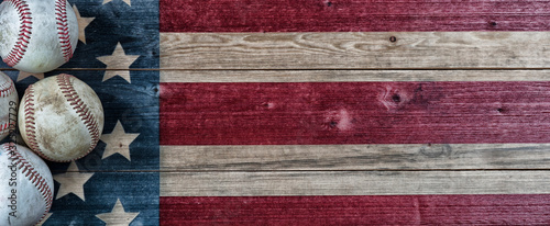 Canvas Print Old baseballs on vintage wooden USA Flag background with copy space