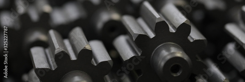 Tableau sur toile Close-up of metal cogs nested in new modern factories for rapid and transit production of different of details