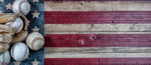 Photography Old baseballs and weathered glove on United States vintage wooden background