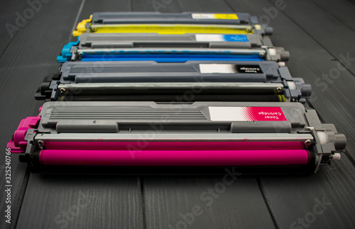 Close-up of cyan and yellow replacement cartridges for the toner of a color laser printer