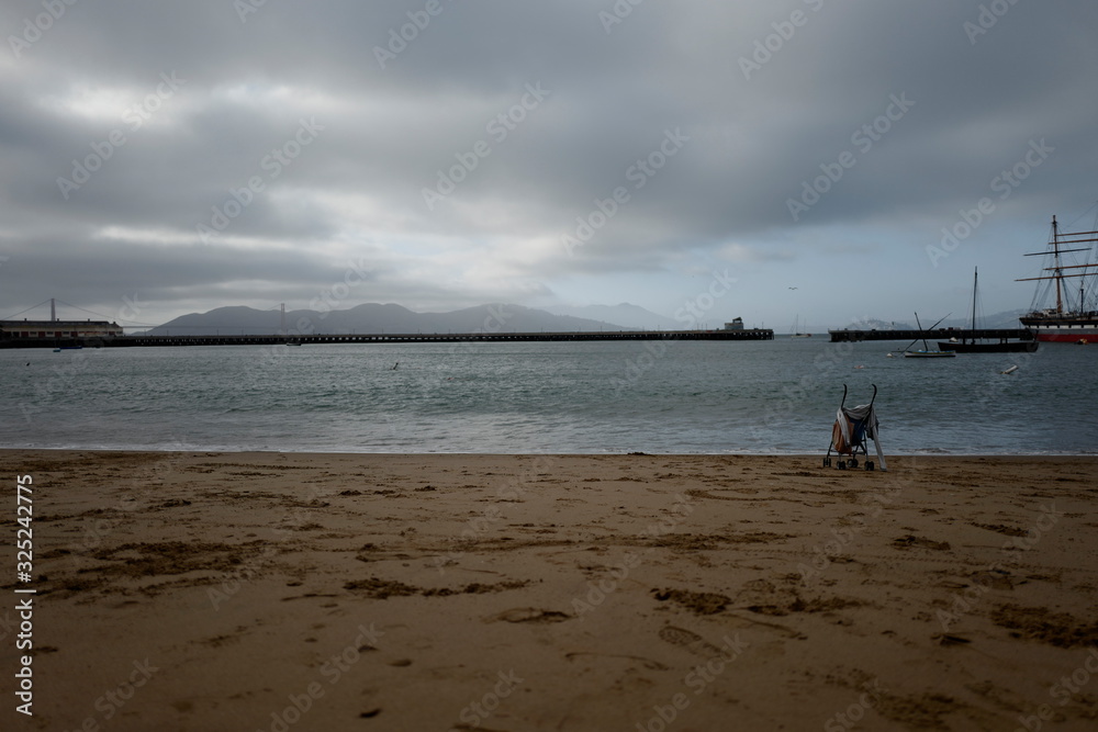 Cloudy sky with beach and stroller