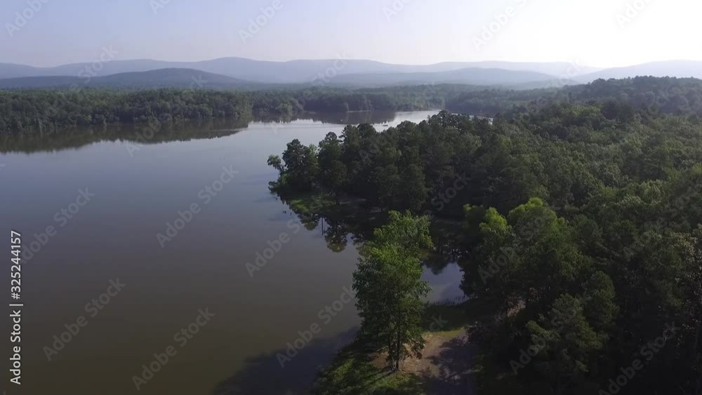 Aerial over a mountain valley lake in summer Aerial over a mountain valley lake in summer