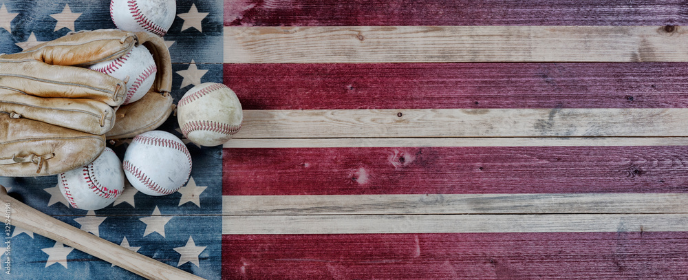 Old baseball objects on United States vintage wooden flag background. Baseball sports concept with copy space