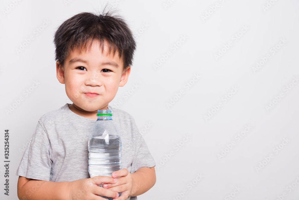 Closeup Asian face, Little children boy drinking water from Plastic bottle Closeup Asian face, Little children boy drinking water from Plastic bottle