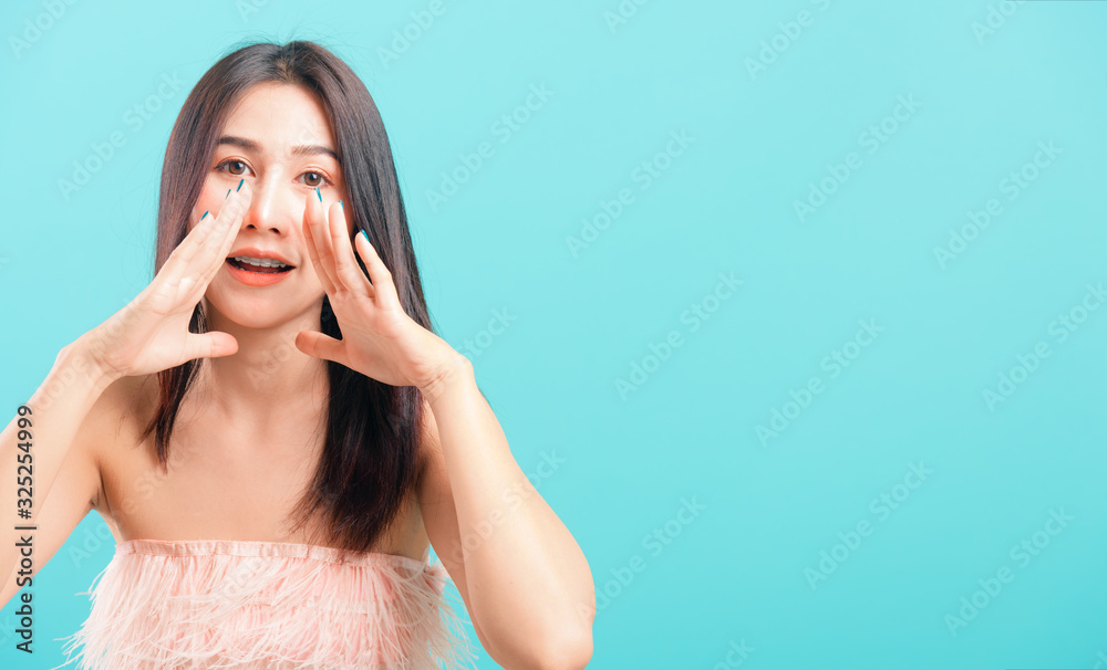 Portrait asian beautiful woman smiling her standing big shout out with hands next mouth Portrait asian beautiful woman smiling her standing big shout out with hands next mouth