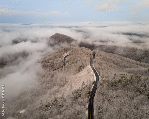 Aerial View of Winding North Carolina Mountain Road in the Snow photo