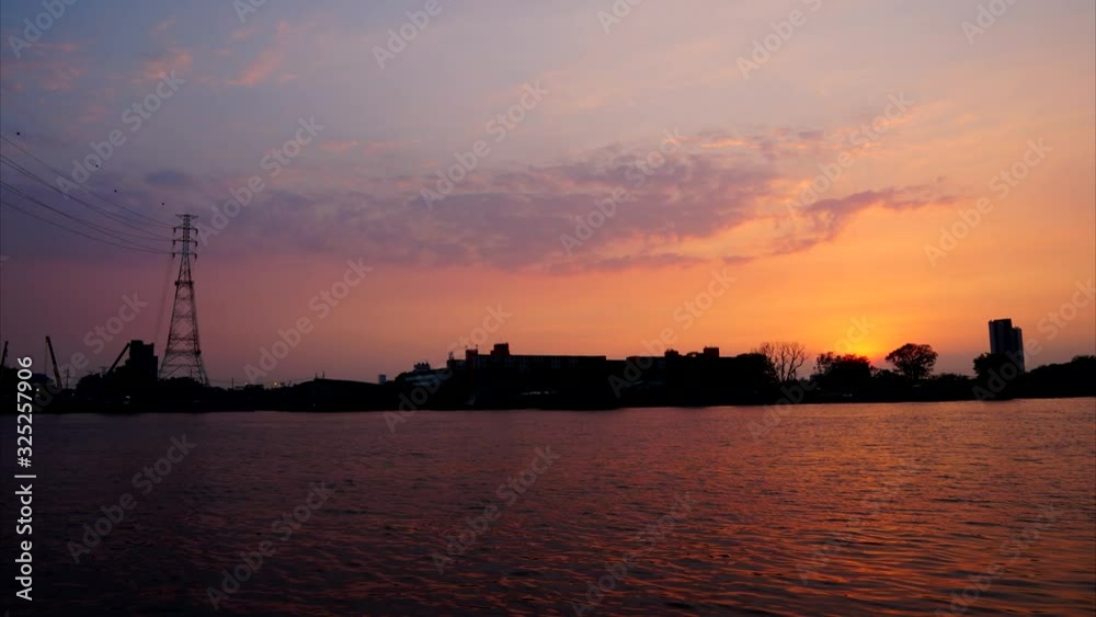 The beautiful time lapse sunset along Chao Phraya river The beautiful time lapse sunset along Chao Phraya river