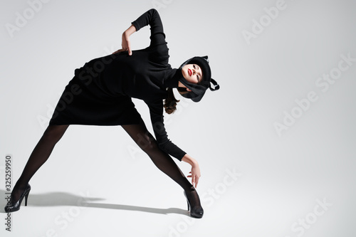black fashionable hat and dress