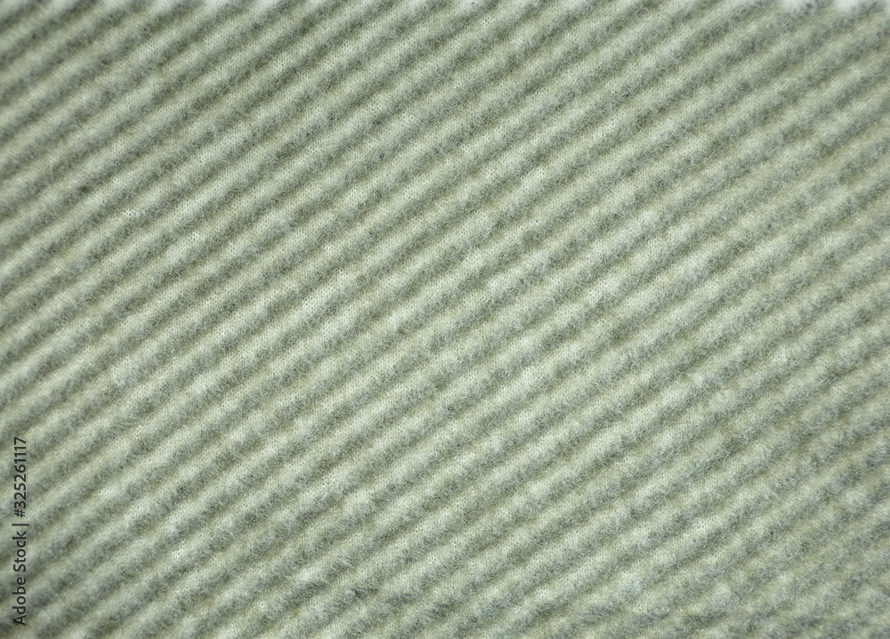 Striped fabric as an abstract original design background. Monochrome fabric. Black stripes on white fabric. Striped fabric as an abstract original design background. Monochrome fabric. Black stripes on white fabric.