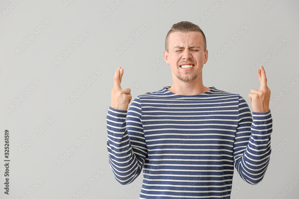 Worried young man on light background Worried young man on light background