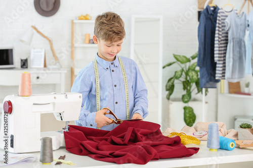 Cute little tailor working ...
