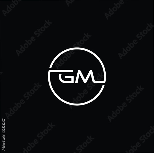Minimal elegant monogram art logo. Outstanding professional trendy awesome artistic GM MG initial based Alphabet icon logo. White color on black background photo