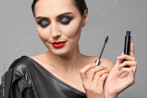 Glamorous woman applying ma...