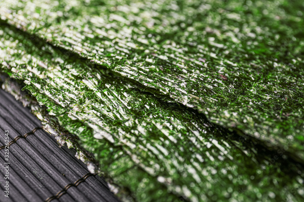 Tasty seaweed sheets on table, closeup Tasty seaweed sheets on table, closeup