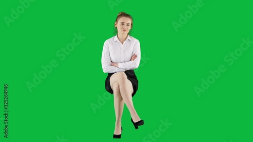 Elegant Businesswoman Sitting and Waiting Green Screen