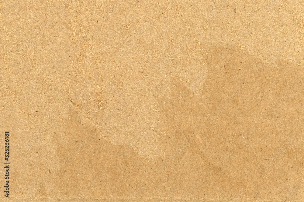 ripped damaged corrugated cardboard background, shredded brown paper ...