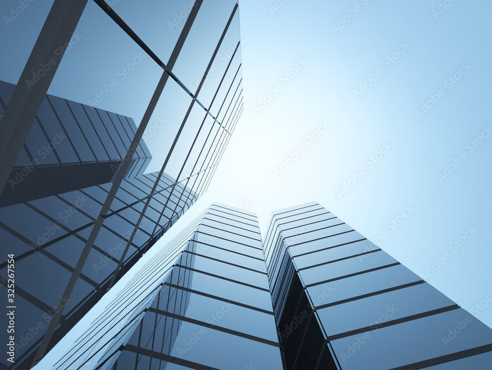 View of high rise glass office building on blue sky background