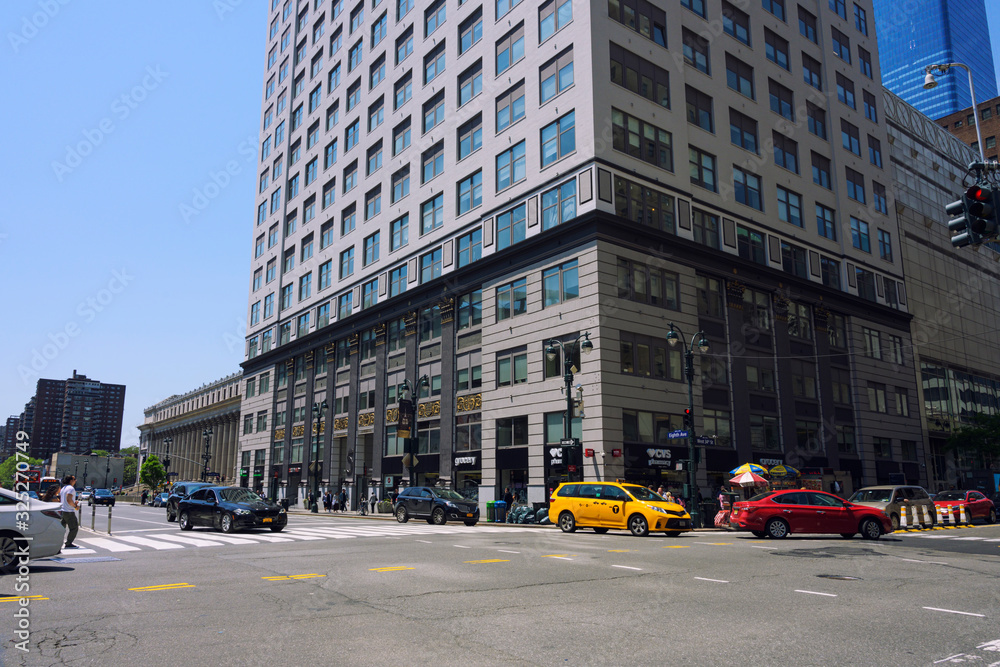 Fototapeta premium New York city, USA-May 2019, 19. Urban image of New York city street with buildings over sky background.