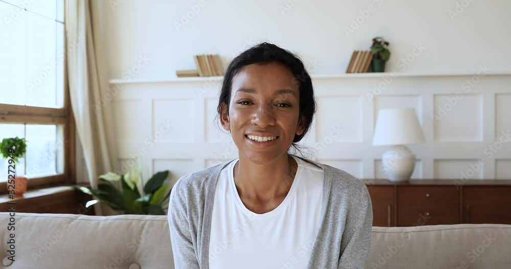Happy african american woman holding video call with friends. Happy african american woman holding video call with friends.