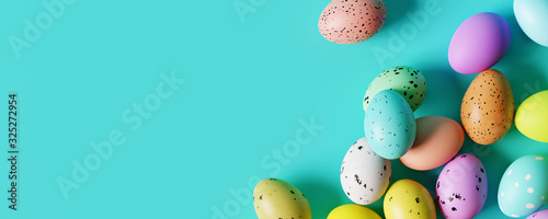 Canvas Print Colorful Easter eggs on pastel blue background