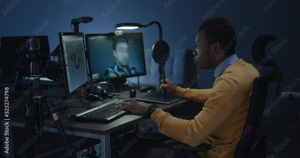 Graphic designers discussing via a video call Graphic designers discussing via a video call
