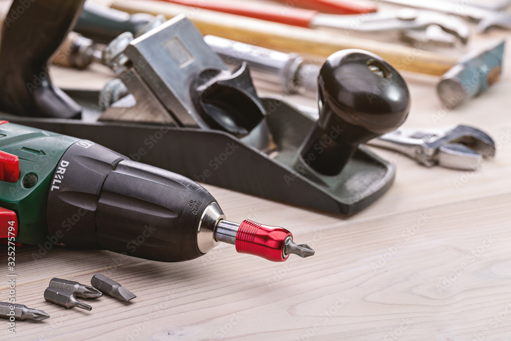A set of tools for doing household chores. Background of household tools. Close-up, studio shot, copy space. A set of tools for doing household chores. Background of household tools. Close-up, studio shot, copy space.