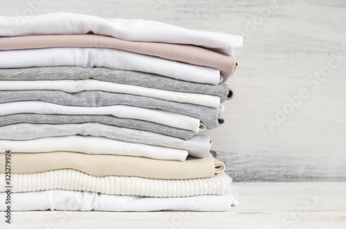 Stacked neutral colored t-shirts