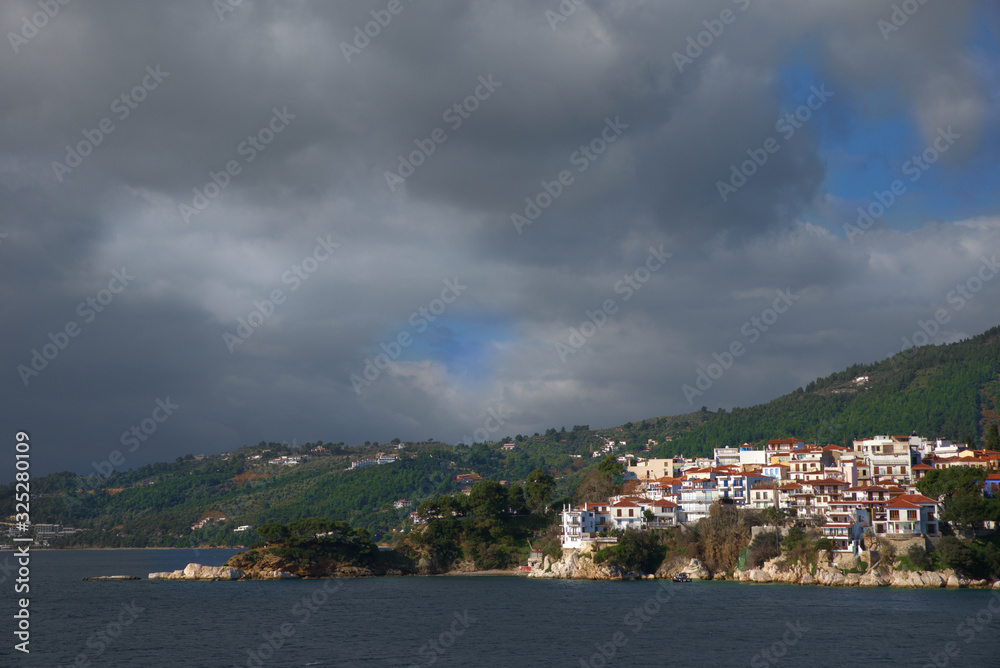 Skiathos island , the most famous island of Greece is one of the most famous Greek destinations in the whole world, here we see a view of the island from a ship. Famous for its beaches, one of the bes