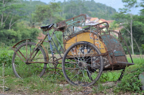 Cycle rickshaw parked at side of road